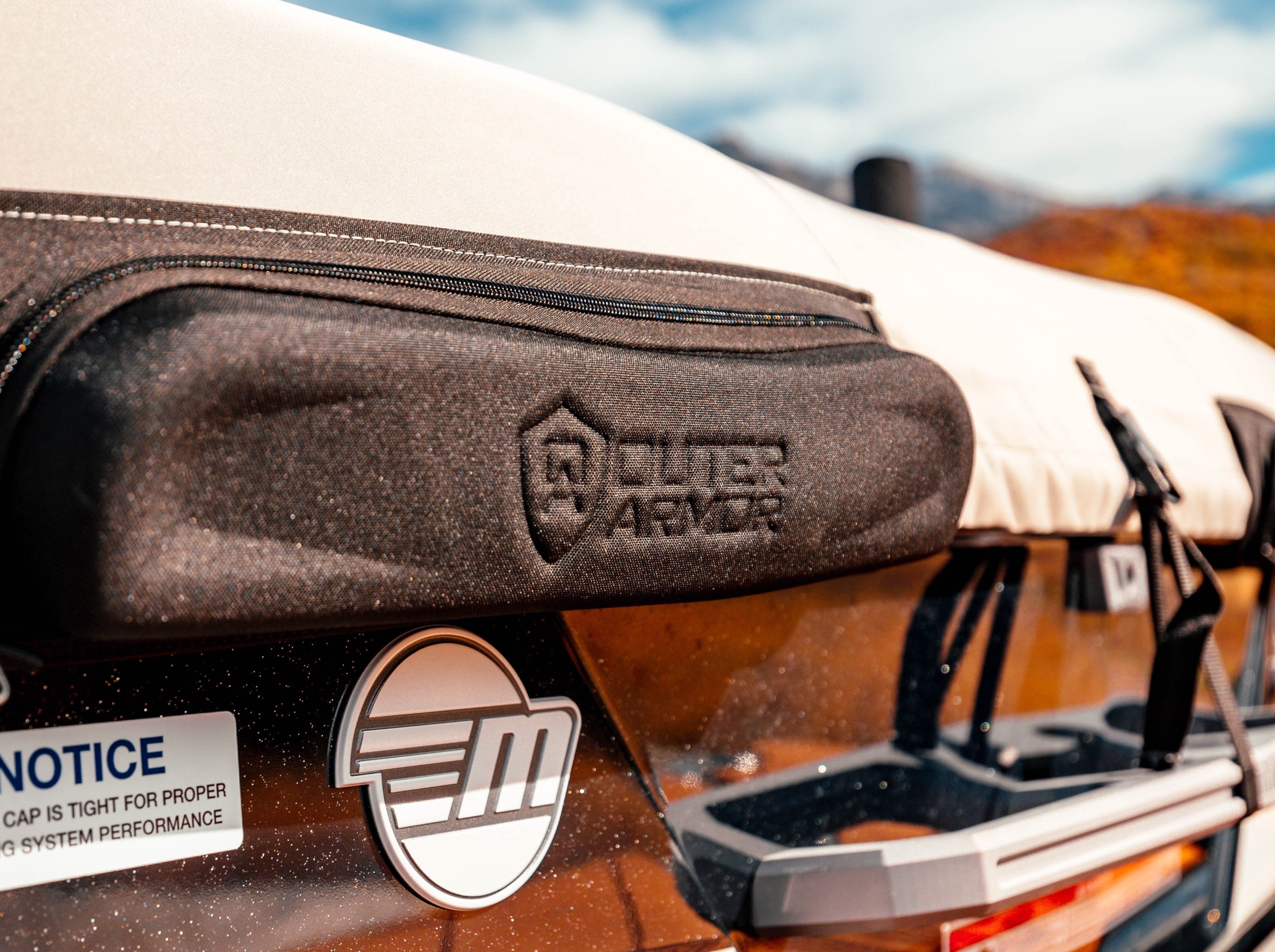 Close-up of a 23 LSV Cover on G3 Tower, featuring a black fabric cover with a zipper and embossed logo, mounted on a boat.